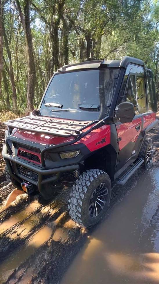 2025 Argo Frontier 700 6x6 splashing into a lake, driven by ATV gear-wearing riders.